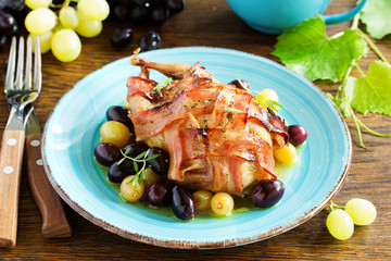 Baked stuffed quail with grape sauce.