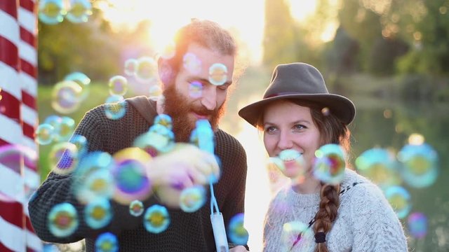 Blowing bubbles at sunset