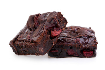 Delicious vegetarian brownie with cherries isolated on white bac