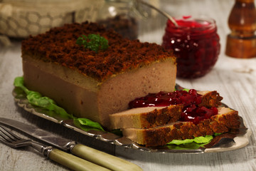 Homemade meat pie with vegetables, served with cranberry sauce