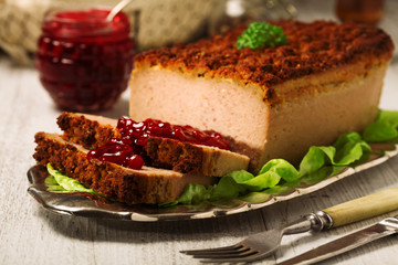 Homemade meat pie with vegetables, served with cranberry sauce