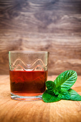 Cold alcohol drink on wooden background