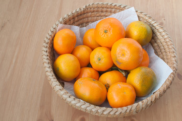 tangerines in a wicker basket