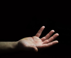 Businessman hand on black dark background