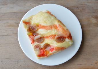 bread topping pork sausage and mayonnaise on dish