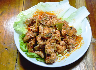 spicy stir fried chicken with herb on Chinese cabbage