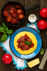 Homemade meatballs in tomato sauce with polenta as a garnish.
