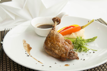  Roast duck leg cuisine serve with sauce fresh and vegetable