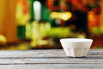 Empty bowl on grey wooden background