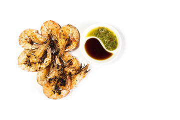 Grilled prawn with spicy sauce. On a white background.