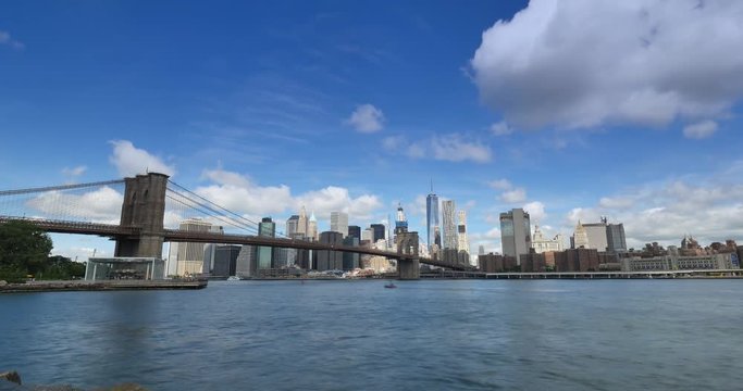 A dramatic summer time lapse view of Lower Manhattan and the Brooklyn Bridge.  	