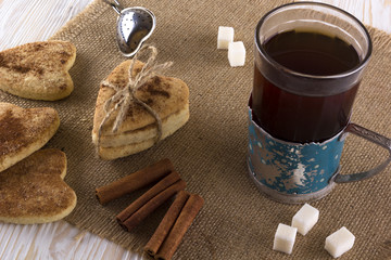 Glass of tea with cinnamon cookies.