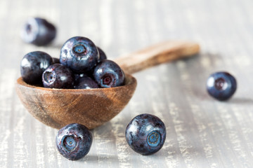 Blueberries on a wooden spoon