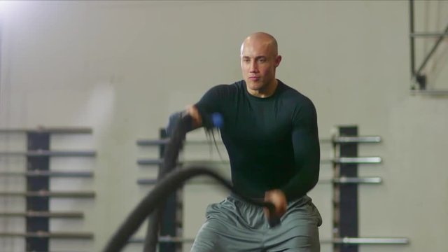 Man working out with ropes