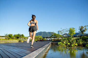 Woman running at borad walk