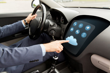 Fototapeta premium close up of man driving car with menu on computer