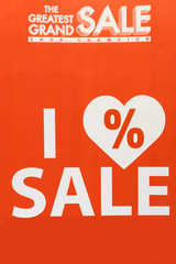 big red discount sale sign and notice in shopping center or mall for shopaholic shopper
