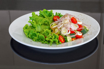 Fresh vegetables  salad on a white plate