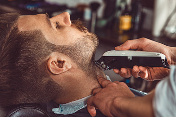 Hipster client visiting barber shop