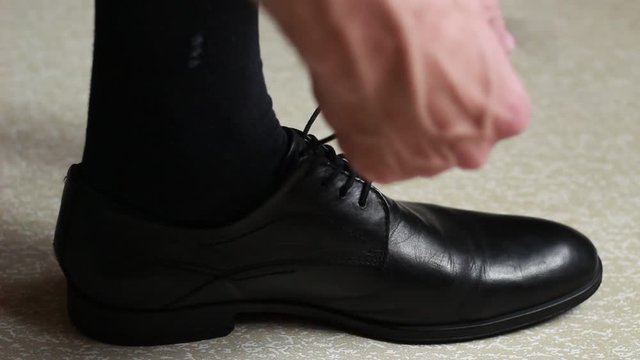 Man taking shoes off