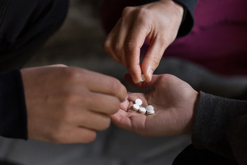 close up of addicts using drug pills