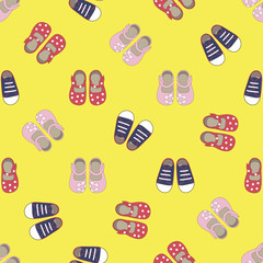 Kids seamless pattern with colored shoes on yellow background