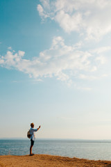 Hiking man using smart phone taking photo, travel and active lifestyle concept