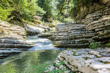 Beautiful landscape with river stream inside stone canyon