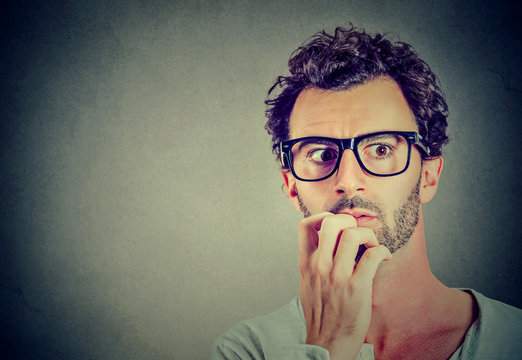 Anxious stressed young man looking away