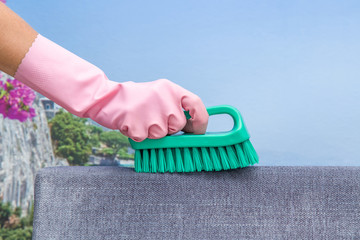 Sofa cleaning with professionally brush. People like to live in a clean environment and home, because it creates a good feeling and comfort. Cleaning service. Summer cleaning or regular clean up.