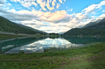 view of a mountain lake in Engadin valley in the summer time