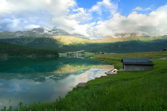 view of a mountain lake in Engadin valley in the summer time