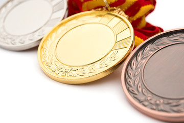 set of gold silver and bronze award medals on white background