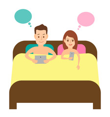 couple in bed with gadgets. man and woman with tablet and smart phone