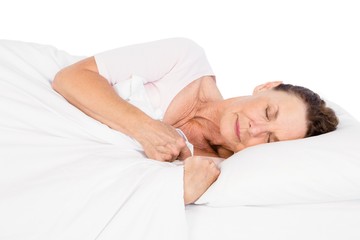 Obraz na płótnie Canvas Side view of woman sleeping on bed