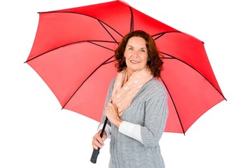 Portrait of happy mature woman holding umbrella