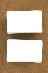 stack of blank name card on brown background