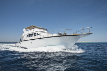 Luxury motor yacht sailing on tropical sea