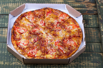 Delicious sliced margarita pizza on a table.