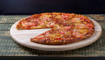 Delicious sliced margarita pizza on a table.