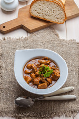 Goulash soup with pork and mushrooms.