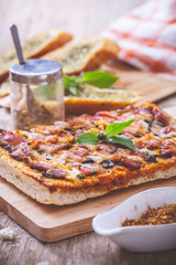 Homemade bacon pizza with garlic bread