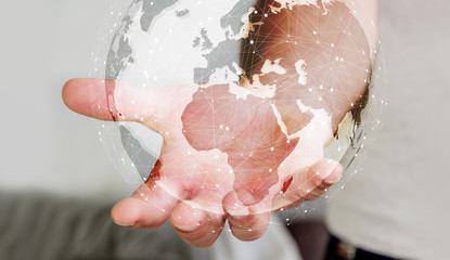 Businessman using digital tactile world interface with his hand