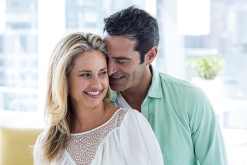 Mid adult romantic couple at home