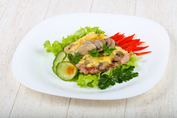 Pork steak with mushroom and cheese