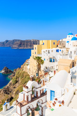 View of colorful houses in Oia village on Santorini island, Greece