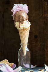 Chocolate and Vanilla Ice Cream Scoops in Waffle Cones