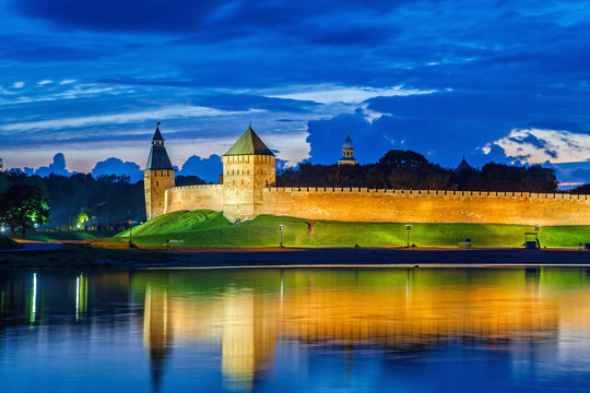 Wall and towers of Novgorod Veliky kremlin, view from opposite side of river Volkhov, Russia