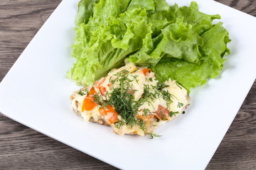 Meat covered cheese and tomato