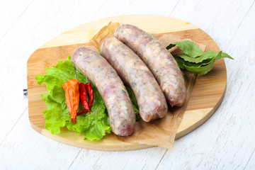 Raw sausages for cooking